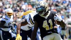 Alvin Kamara looks to the endzone as he slips by several Chargers defenders. Visit Tim's Fantasy Tips for all things fantasy football.